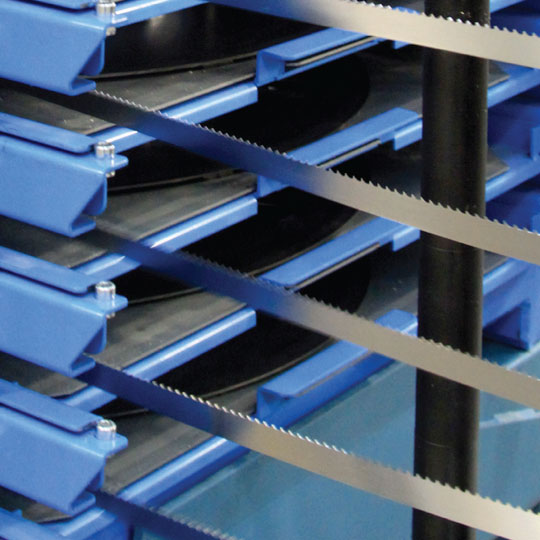 Finished band-saw blade coils staged in the Italian finishing rack